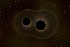 Two black holes spiral each other as they prepare to merge in this illustration. Image credit: Copyright ESA.