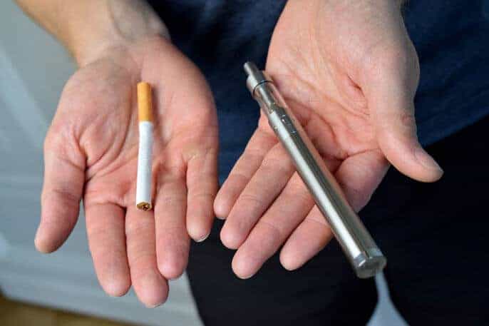 Cigarette next to vape pen