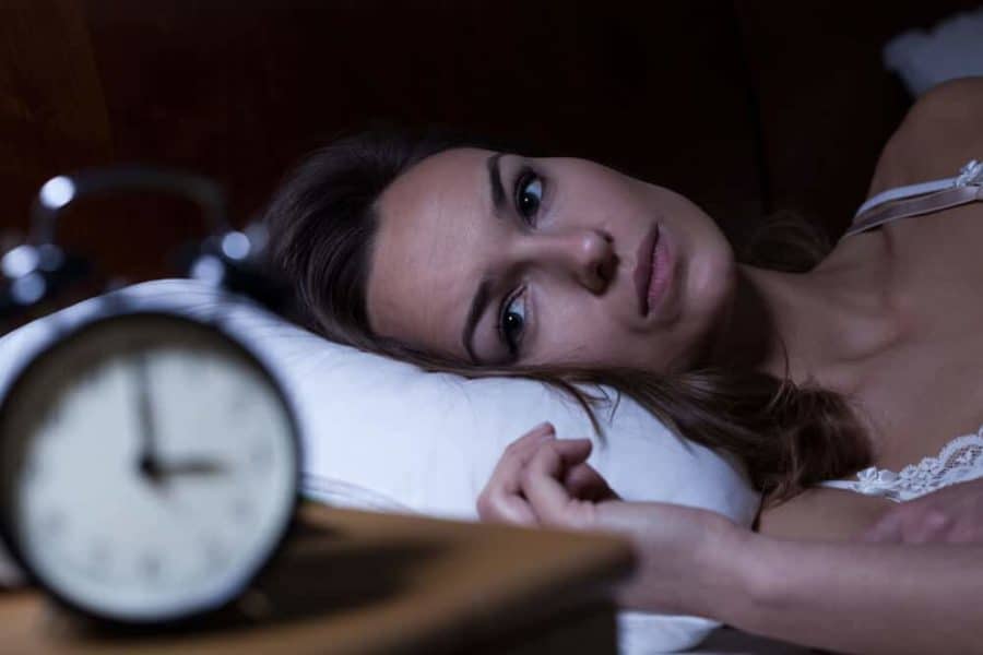 Woman with insomnia in bed