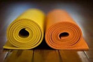 Yoga mats rolled up.