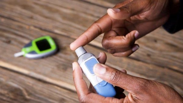 Finger getting pricked for a blood sugar test