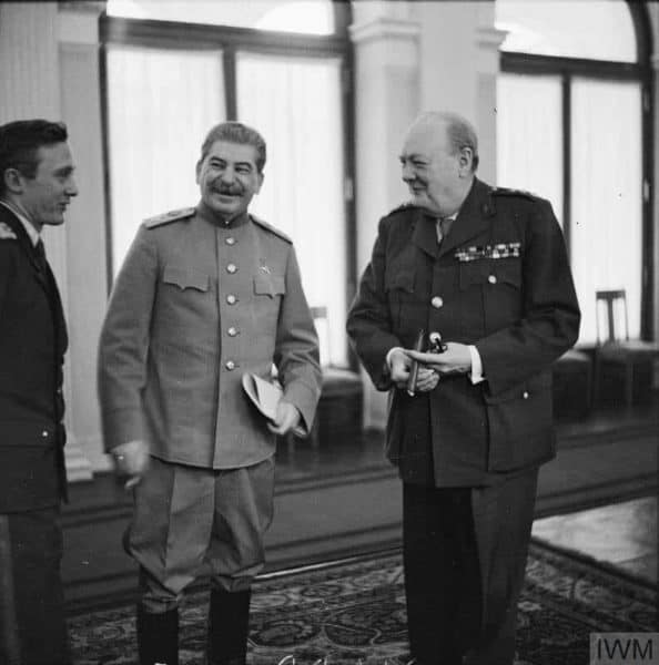 Winston Churchill sharing a joke with Joseph Stalin and his interpreter, Pavlov at Livadia Palace during the Yalta Conference in February 1945.