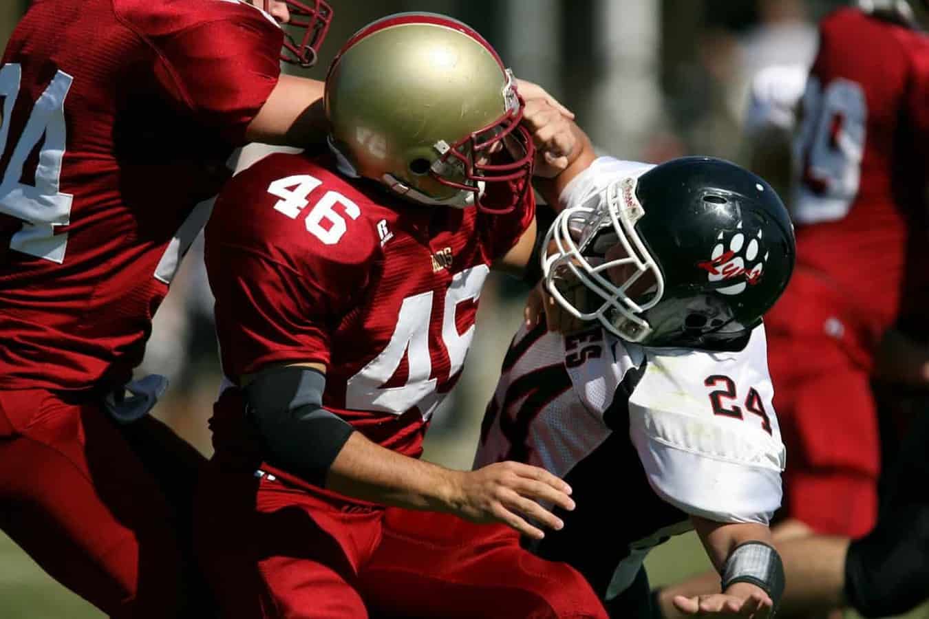 football players clashing on field