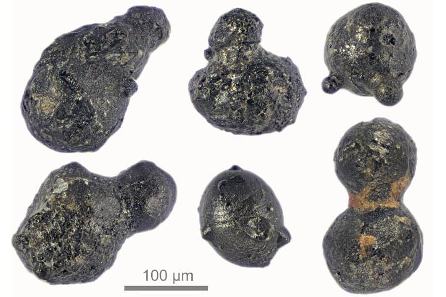 Particles from an exploding meteor that reached the Antarctic ice sheet 430,000 years ago. The particles are evidence of an airburst — a large meteorite or comet collision with the atmosphere that leaves no crater behind — that created a jet of melted and vaporized meteoritic material that passed through the atmosphere to reach the Earth’s surface. (Courtesy of Scott Peterson / micrometeorites.com)