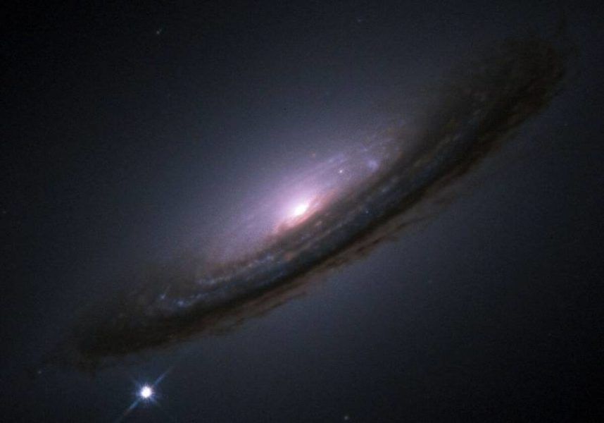 Pictured is the supernova of the type Ia star 1994D, in galaxy NGC 4526. The supernova is the bright spot in the lower left corner of the image. Image credit: ESA/Hubble