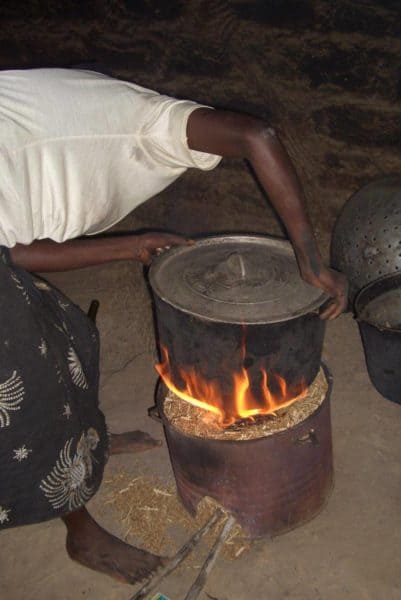 Simple biomass-burning cookstoves such as this "rocket" stove in Senegal could help reduce emissions from cooking over wood fires, a major driver of climate change and deforestation. Photo courtesy of Gunther Bensch