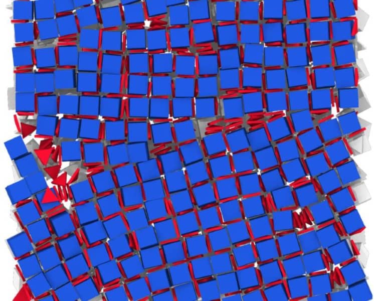 Cubes of lead telluride and triangles of lanthanum fluoride self-assembled into a grid in the lab, when the researchers followed the conditions discovered through the computer simulations. This technique could help enable new kinds of materials with new properties. The scale bar on the electron microscope image is 100 nanometers. Image credit: Murray Lab, University of Pennsylvania