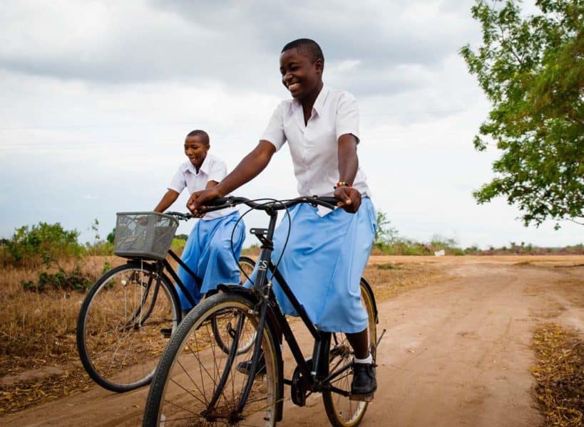 Secondary Scholars Salima and Zawadi travel to school on bicycles. Bibaha, Tanzania. Credit: CAMFED/Eliza Powell