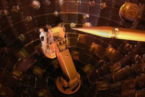 A technician works at the National Ignition Facility. Scientists used the array of 196 lasers to create conditions similar to the hot gas inside gigantic galaxy clusters.