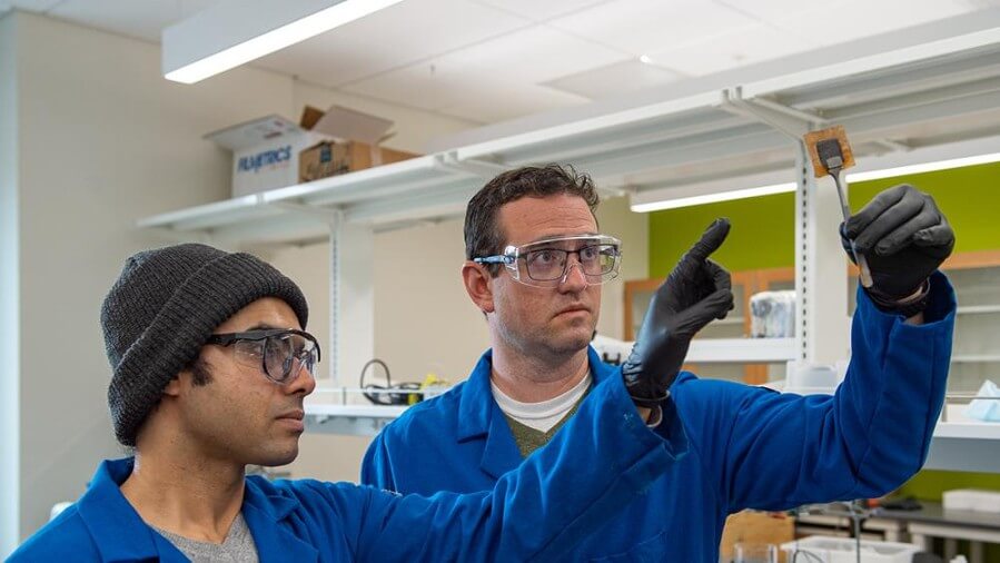 Chris Arges (right), Penn State associate professor of chemical engineering, proposes using high-temperature proton-selective polymer electrolyte membranes, or PEMs, to separate hydrogen from other gases in an ACS Energy Letters paper. Co-author Deepra Bhattacharya, Penn State doctoral student in chemical engineering, is seen at left. Credit: Kelby Hochreither/Penn State. All Rights Reserved.