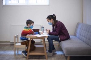 Autistic child and teacher