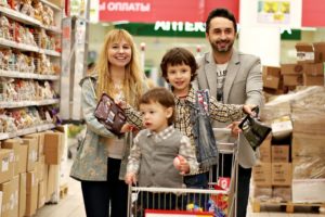 A family shopping in a grocery store.