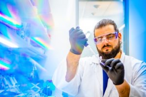 Petar Pajic, UB PhD student in biological sciences, prepares a saliva sample for separation and analysis. In the new study, the team used a gel electrophoresis technique to separate mucins from other proteins in the saliva of various mammals.