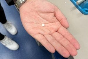 An insulin pill in man's palm