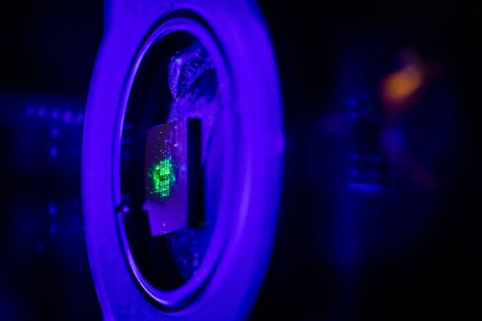 Green laser light illuminates a metasurface that is a hundred times thinner than paper, that was fabricated at the Center for Integrated Nanotechnologies. CINT is jointly operated by Sandia and Los Alamos national laboratories for the Department of Energy Office of Science.