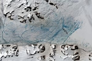 Conchie, Hubert, Saturn, Venus and Uranus glaciers draining into a meltwater-laden George VI Ice Shelf.