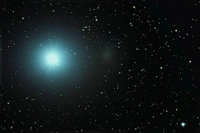 The ultra-faint Milky Way companion galaxy Leo I appears as a faint patch to the right of the bright star, Regulus.