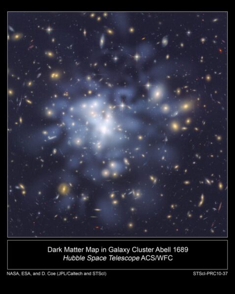 This NASA Hubble Space Telescope image shows the distribution of dark matter in the center of the giant galaxy cluster Abell 1689, containing about 1,000 galaxies and trillions of stars. Dark matter is an invisible form of matter that accounts for most of the universe’s mass. Hubble cannot see the dark matter directly. Astronomers inferred its location by analyzing the effect of gravitational lensing, where light from galaxies behind Abell 1689 is distorted by intervening matter within the cluster. Researchers used the observed positions of 135 lensed images of 42 background galaxies to calculate the location and amount of dark matter in the cluster. They superimposed a map of these inferred dark matter concentrations, tinted blue, on an image of the cluster taken by Hubble’s Advanced Camera for Surveys. If the cluster’s gravity came only from the visible galaxies, the lensing distortions would be much weaker. The map reveals that the densest concentration of dark matter is in the cluster’s core. Abell 1689 resides 2.2 billion light-years from Earth. The image was taken in June 2002. Image credit: NASA, ESA, D. Coe (NASA Jet Propulsion Laboratory/California Institute of Technology, and Space Telescope Science Institute), N. Benitez (Institute of Astrophysics of Andalusia, Spain), T. Broadhurst (University of the Basque Country, Spain), and H. Ford (Johns Hopkins University)