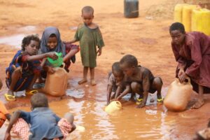 Children collect water at a camp in Dadaab, Kenya. Photo: journalturk/iStock