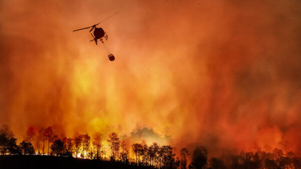 Major fire with helicopter dropping water