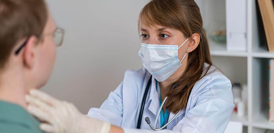 Doctor examining a patient Credit: Natalia Gdovskaia via Getty Images