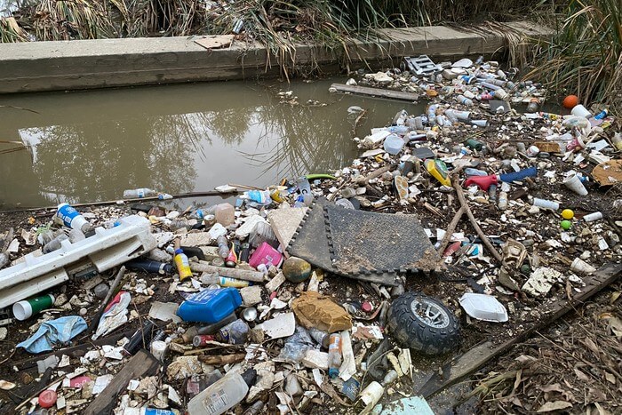 Plastic waste in a creek bed at Fairmount Park in Riverside, Calif. David Danelski/UCR