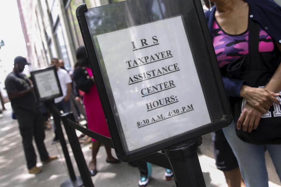 Consumers waiting in line to talk to IRS