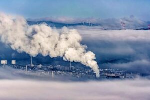 Pollution from factory drifts high into the atmosphere in this image