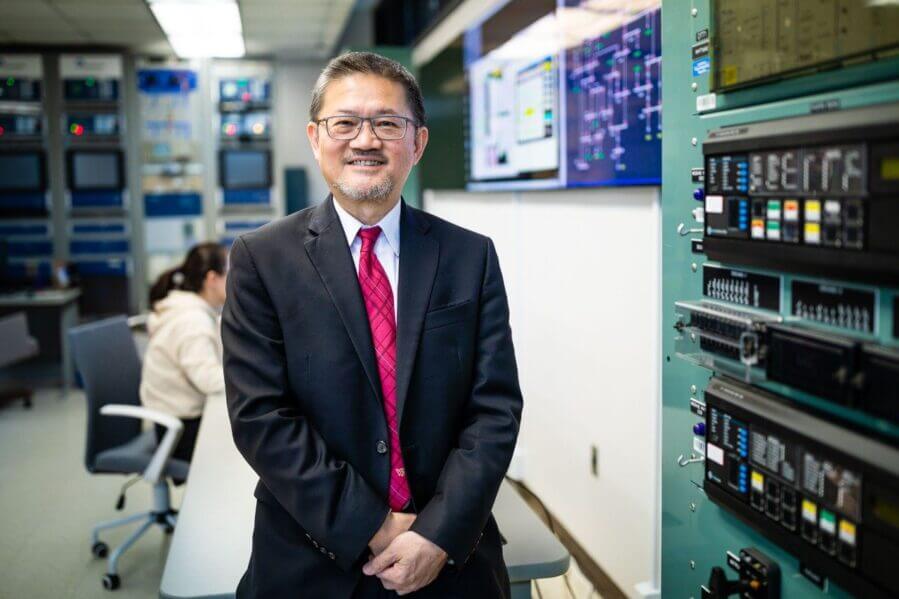 Chen-Ching Liu stands in the Power and Energy Center Lab at Virginia Tech's Blacksburg campus. Photo by Peter Means for Virginia Tech.