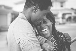 An African American couple smiling