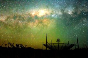 The HERA radio telescope, located in Karoo in South Africa, consists of 350 dishes pointed upward to detect radio waves from the early universe.