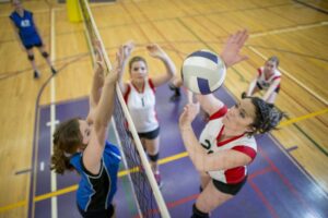 Playing volleyball in high school can help you get into college -- but don't load up on too many activities.