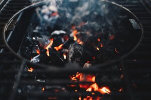 Charcoal smoking on a grill