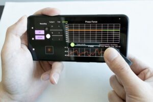 Prototype of the blood pressure monitoring clip. The user presses on the clip and a custom smartphone app guides the user on how hard and long to press during the measurement.