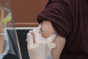 Patient receiving a COVID-19 vaccination in their arm Credit: Steven Cornfield