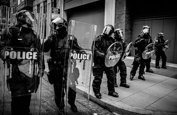 Black and white image of a police line