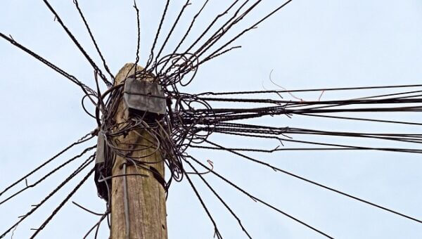 Telephone wires in a tangle. Credit Pixabay.