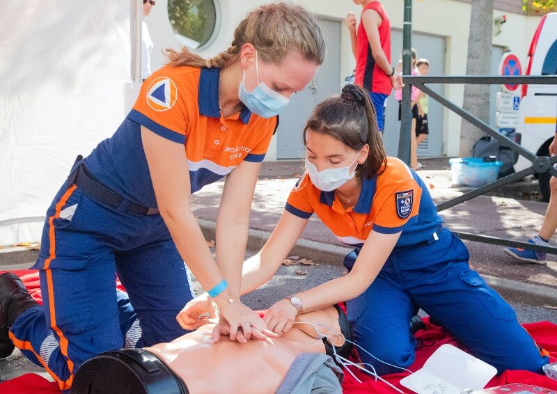 Two female EMT's giving CPR