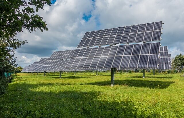 Solar panels on a green lawn. credit pixabay