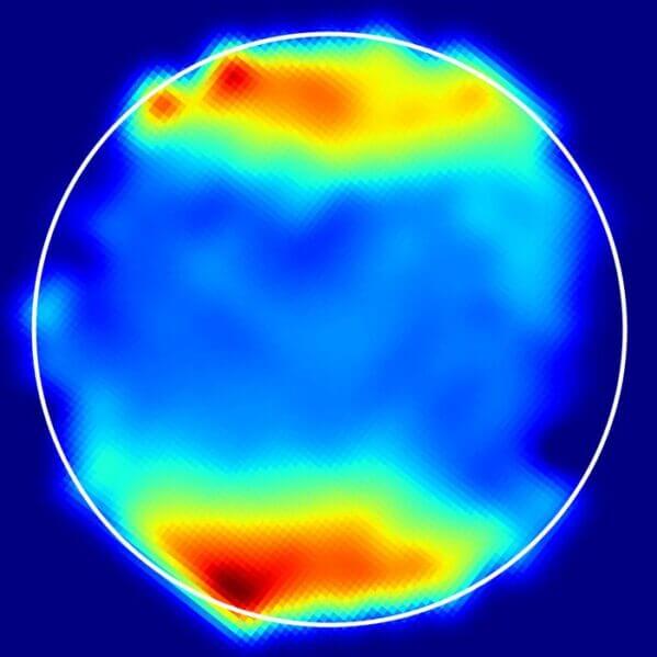 A spectroscopic map of Ganymede derived from JWST measurements shows light absorption around the poles characteristic of the molecule hydrogen peroxide. The circle outlines the surfaces of the moon.