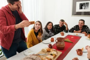 A Mexican-origin family enjoys their traditional cake for Dia De Los Reyes, or Day of the Kings, around table. (Getty Images)
