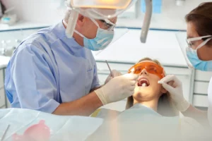 Dentist working in the mouth of a patient