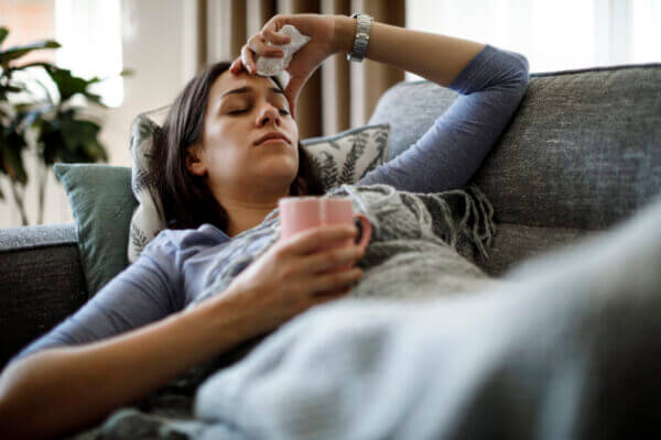 Sick woman on couch. Courtesy of UCSF