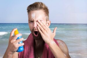 Man getting sunscreen in eye. Pixabay