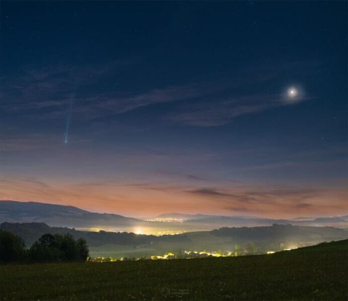 This scene would be beautiful even without the comet. By itself, the sunrise sky is an elegant deep blue on high, with faint white stars peeking through, while near the horizon is a pleasing tan. By itself, the foreground hills of eastern Slovakia are appealingly green, with the Zadňa hura and Veľká hora hills in the distance, and with the lights of small towns along the way. Venus, by itself on the right, appears unusually exquisite, surrounded by a colorful atmospheric corona. But what attracts the eye most is the comet. On the left, in this composite image taken just before dawn yesterday morning, is Comet Nishimura. On recent mornings around the globe, its bright coma and long ion tail make many a morning panoramic photo unusually beautiful. Tomorrow, C/2023 P1 (Nishimura) will pass its nearest to the Earth for about the next 434 years.