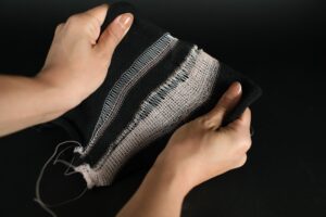 Researchers from MIT and Northeastern University developed a liquid crystal elastomer fiber that can change its shape in response to thermal stimuli. The fiber, which is fully compatible with existing textile manufacturing machinery, could be used to make morphing textiles, like a jacket that becomes more insulating to keep the wearer warm when temperatures drop.