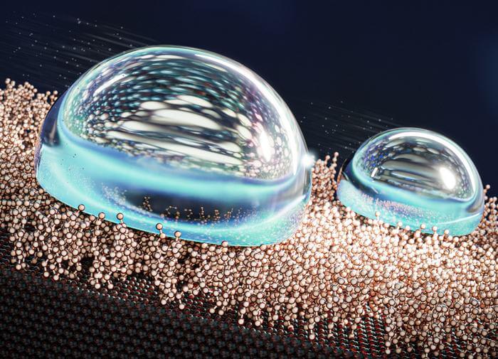 An artist's depiction of the liquid-like layer of molecules repelling water droplets.