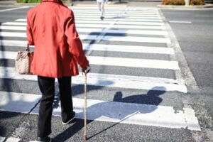 Mature woman crossing the street