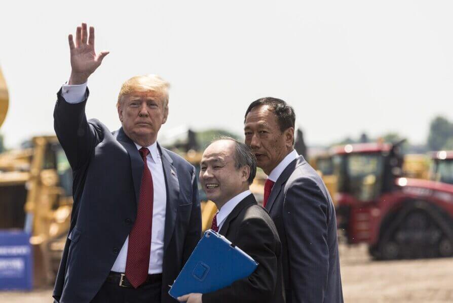 Former U.S. President Donald Trump with Foxconn CEO Terry Gou (right) and Masayoshi Son, chairman and CEO of SoftBank Group watch at the groundbreaking for the Foxconn Technology Group computer screen plant in 2018 in Mt. Pleasant, Wisconsin. Getty