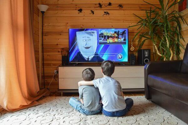 young brothers watching tv